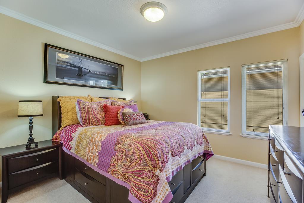 641 Hickey Boulevard Pacifica, CA 94044 - Photo 12 of 32 a bedroom with a bed and a window