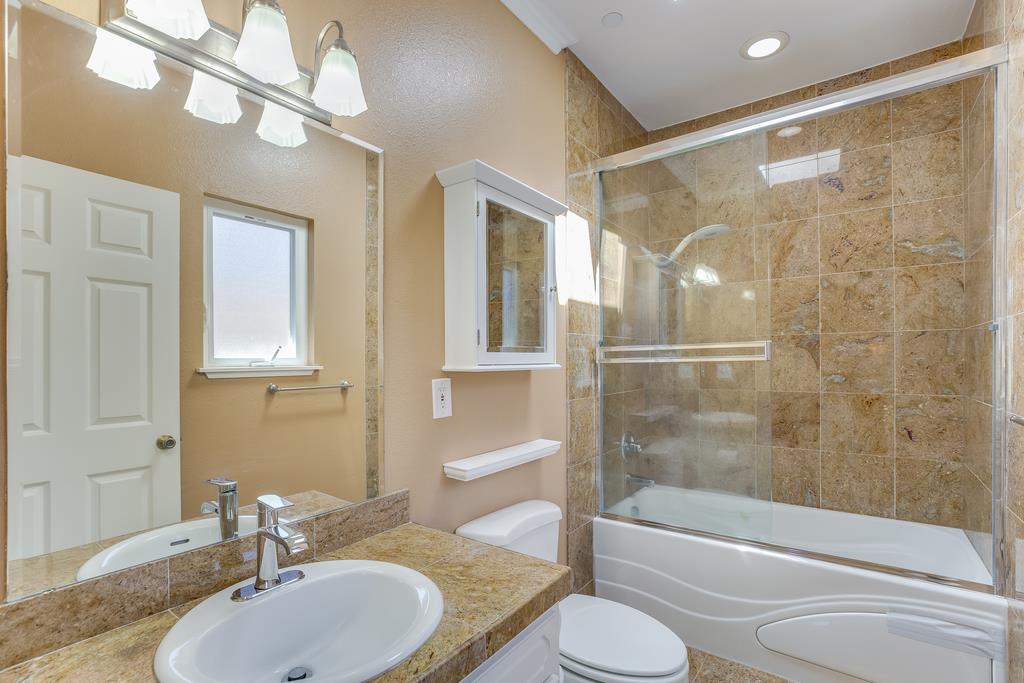 641 Hickey Boulevard Pacifica, CA 94044 - Photo 16 of 32 a bathroom with a sink toilet and shower