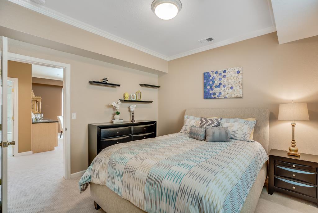 641 Hickey Boulevard Pacifica, CA 94044 - Photo 22 of 32 a bedroom with a bed and wooden floor