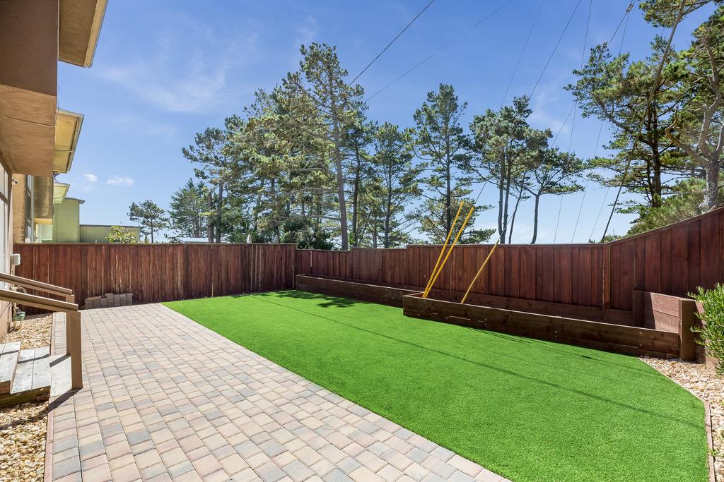 641 Hickey Boulevard Pacifica, CA 94044 - Photo 27 of 32 a view of a backyard with wooden fence