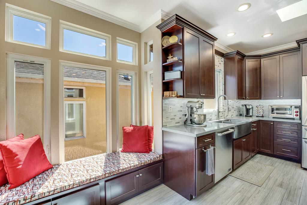 641 Hickey Boulevard Pacifica, CA 94044 - Photo 9 of 32 a kitchen with kitchen island granite countertop a sink stove and cabinets