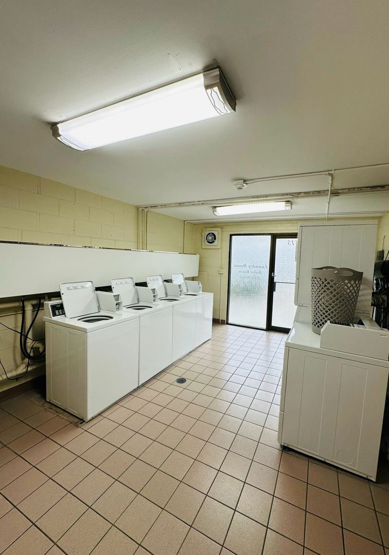 3515 Central Road, Unit 103 Glenview, IL 60025 - Photo 15 of 27 a large white room with a white cabinet and a view of kitchen