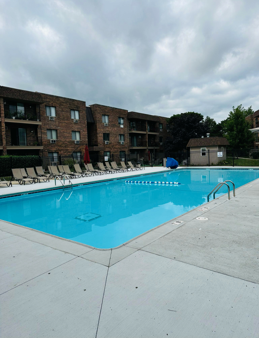 3515 Central Road, Unit 103 Glenview, IL 60025 - Photo 20 of 27 an outdoor view with swimming pool having outdoor seating