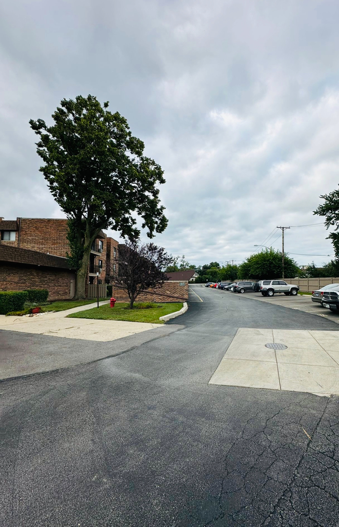 3515 Central Road, Unit 103 Glenview, IL 60025 - Photo 27 of 27 a view of a swimming pool with a yard and plants
