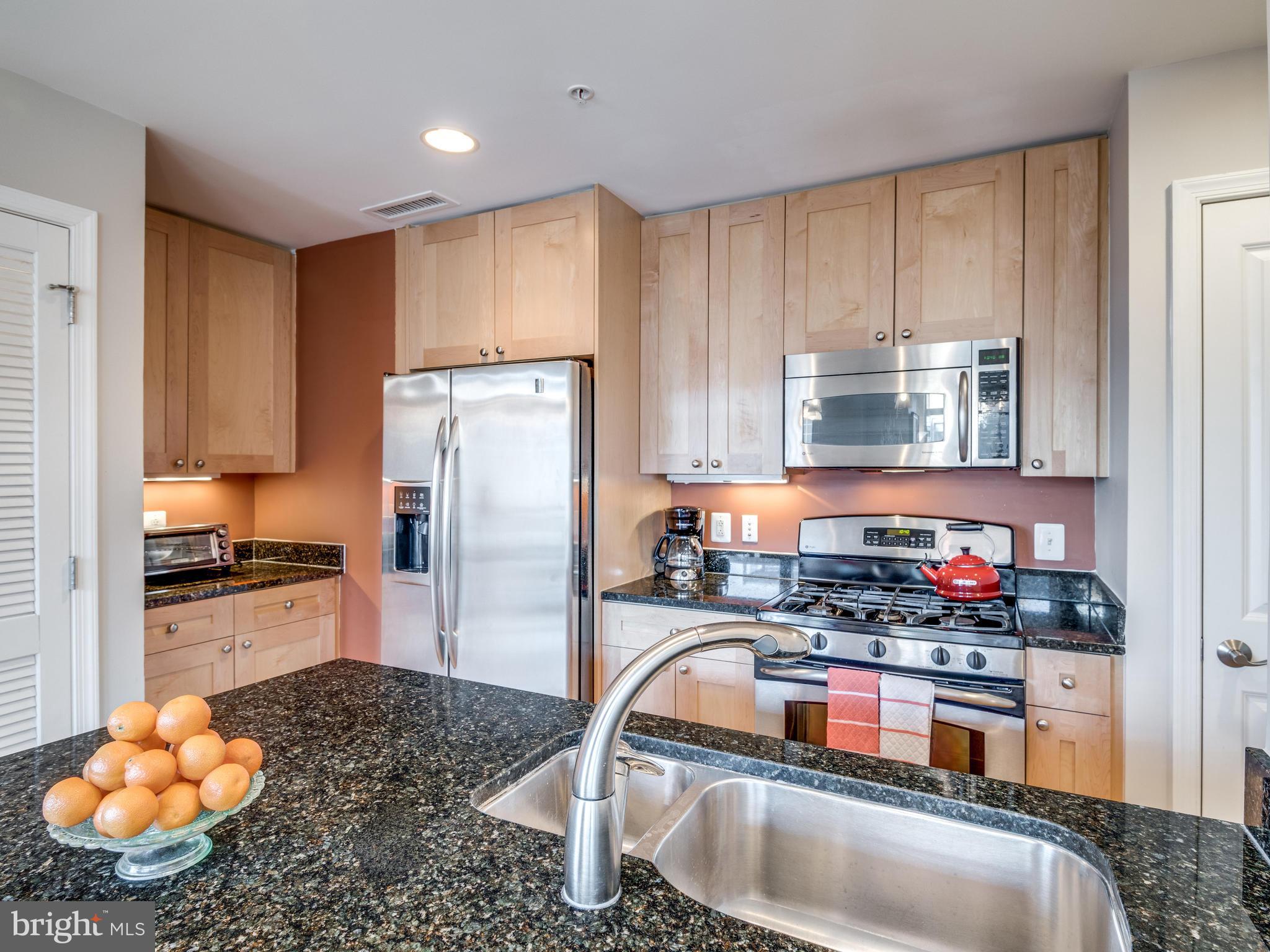 11990 Market Street, Unit 606 Reston, VA 20190 - Photo 2 of 30 Kitchen with Granite Counters