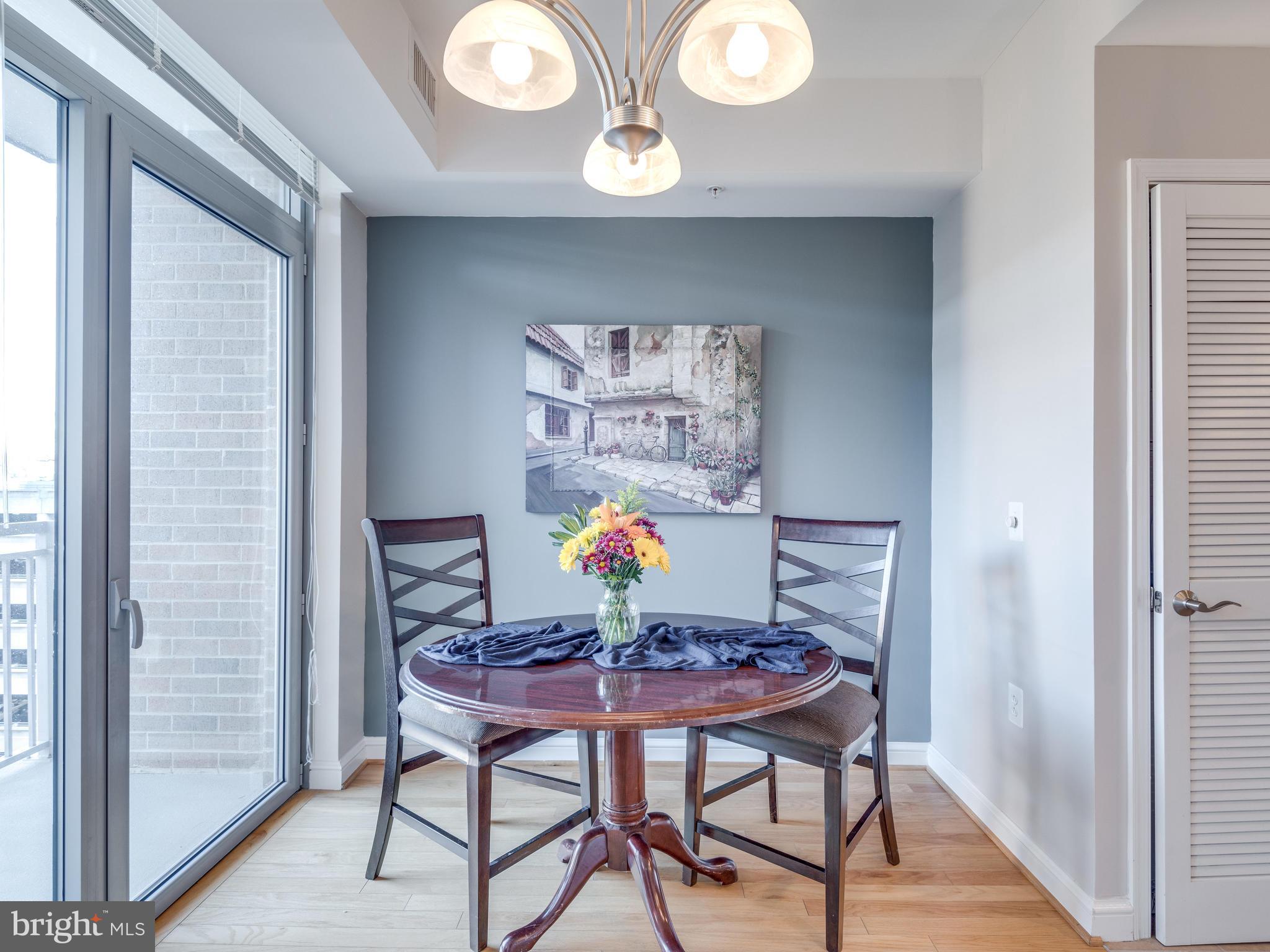 11990 Market Street, Unit 606 Reston, VA 20190 - Photo 7 of 30 Dining Room with Balcony