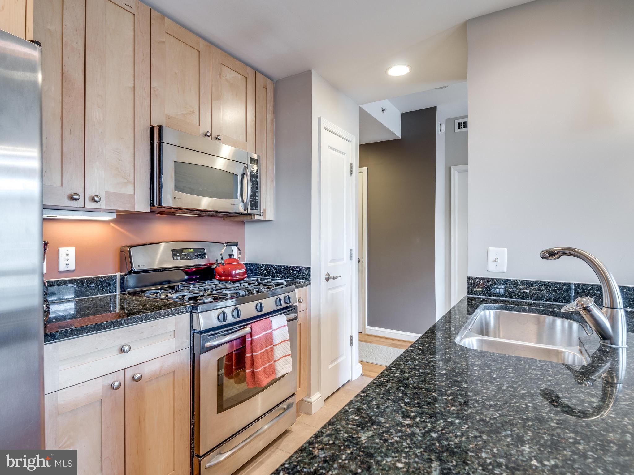 11990 Market Street, Unit 606 Reston, VA 20190 - Photo 9 of 30 Kitchen with Plenty Cabinetry