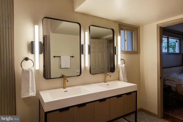 a view of a roof deck with wooden fence and a bench