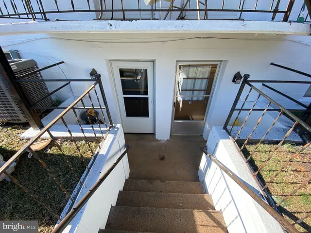 a view of a living room and entryway