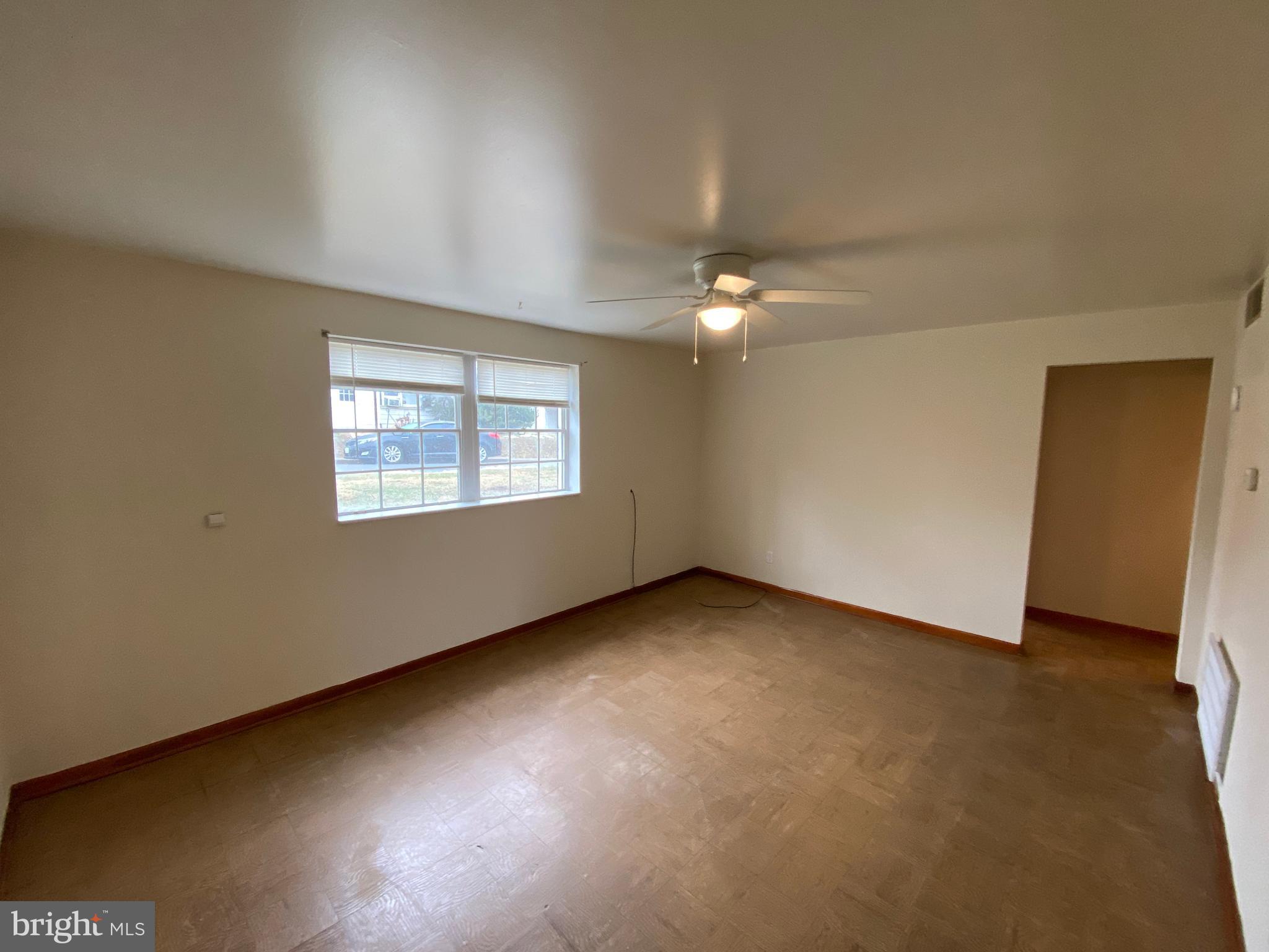 423 Hill Street, Unit 2 Culpeper, VA 22701 - Photo 2 of 18 an empty room with a window