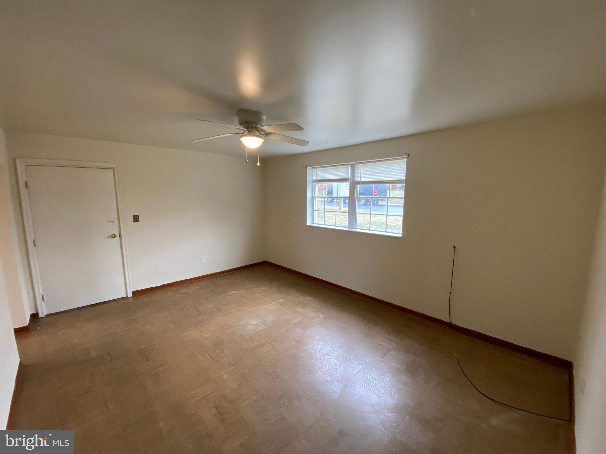 423 Hill Street, Unit 2 Culpeper, VA 22701 - Photo 3 of 18 a view of an empty room with a window