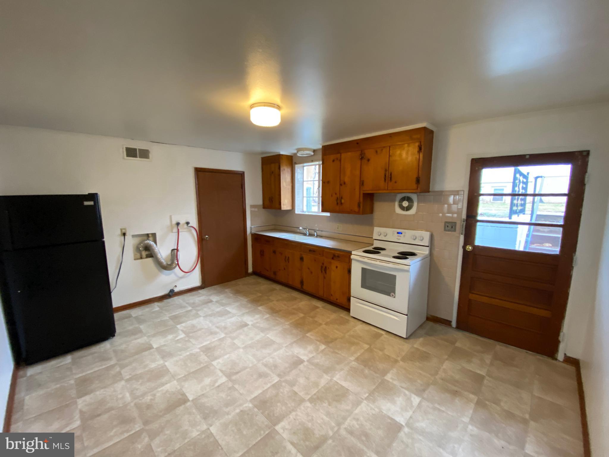 423 Hill Street, Unit 2 Culpeper, VA 22701 - Photo 6 of 18 a kitchen with stainless steel appliances a stove a refrigerator and a sink
