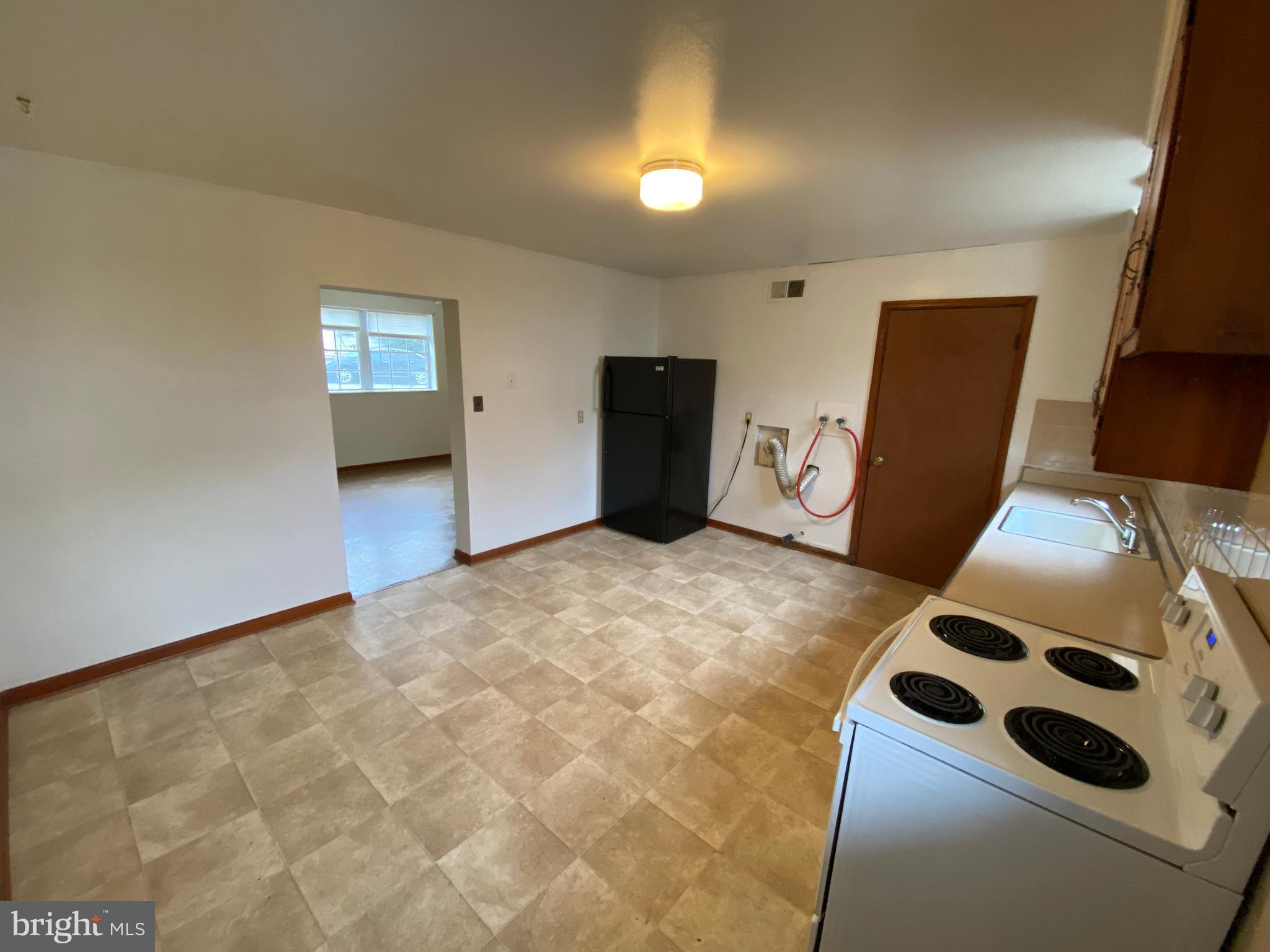 423 Hill Street, Unit 2 Culpeper, VA 22701 - Photo 7 of 18 a bedroom with a bed and a dresser