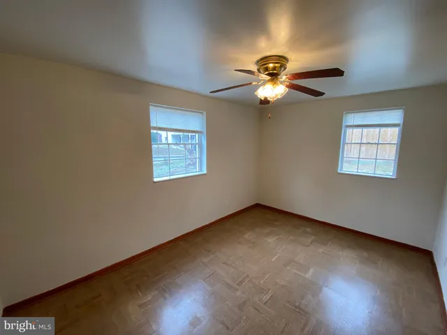 a view of room with window and ceiling fan