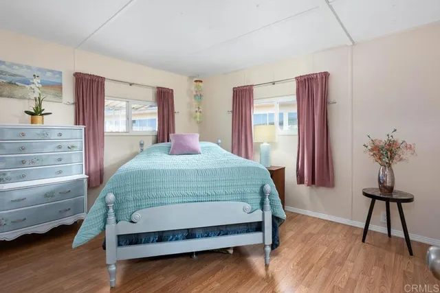 a bedroom with a bed and a table