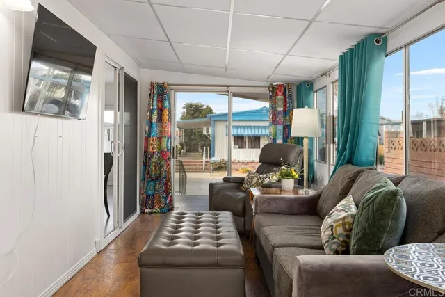 a living room with furniture and a large window