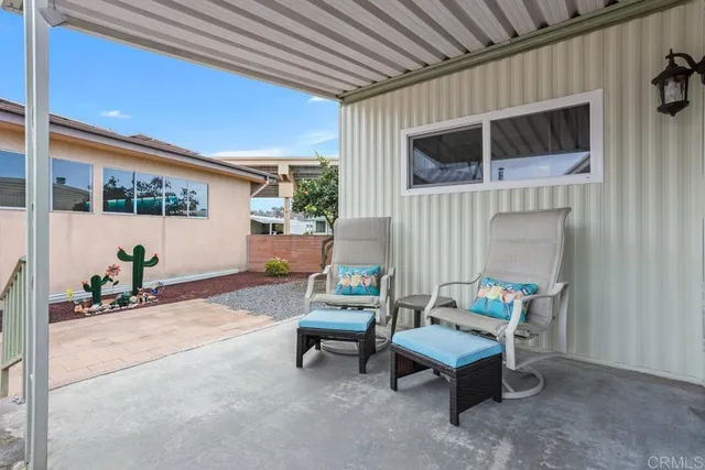 a outdoor living space with furniture and a potted plant