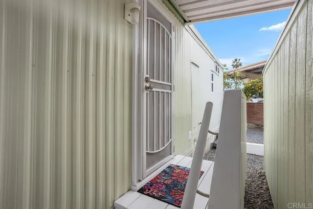 a view of a hallway with windows