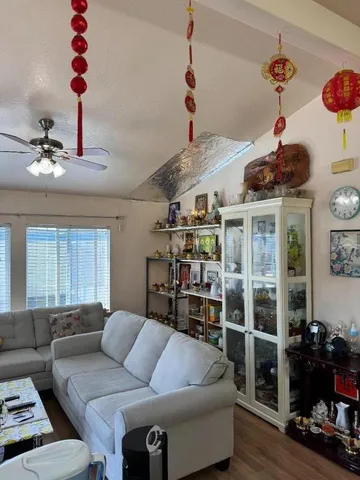 a living room with furniture and a window