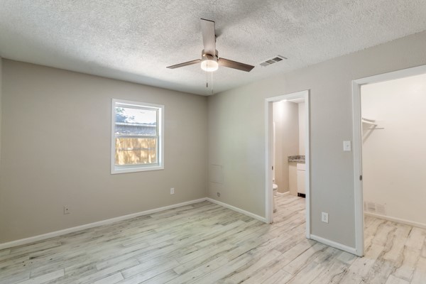 4104 Marsh Street Bryan, TX 77803 - Photo 16 of 26 wooden floor in an empty room with a window