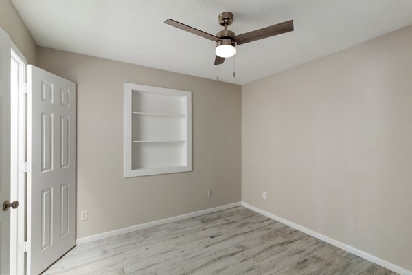 4104 Marsh Street Bryan, TX 77803 - Photo 18 of 26 an empty room with a window and a ceiling fan