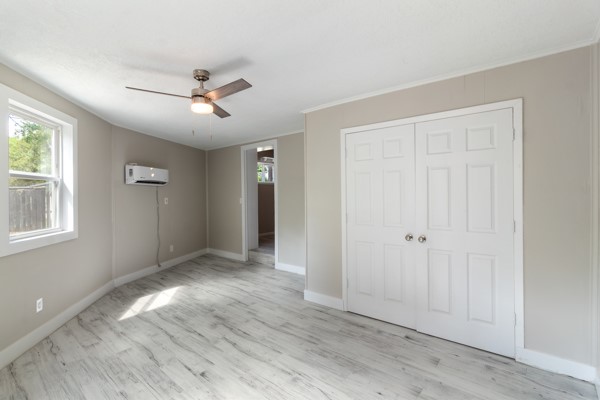 4104 Marsh Street Bryan, TX 77803 - Photo 22 of 26 a view of empty room with wooden floor and fan