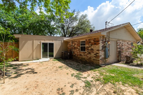 4104 Marsh Street Bryan, TX 77803 - Photo 25 of 26 a view of house with backyard and glass windows