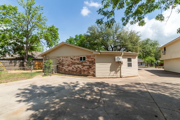 4104 Marsh Street Bryan, TX 77803 - Photo 26 of 26 a front view of house with yard and trees in the background