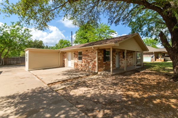 4104 Marsh Street Bryan, TX 77803 - Photo 3 of 26 a front view of a house with a garden