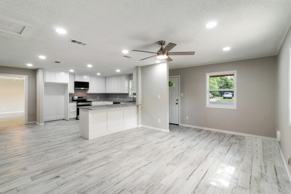 4104 Marsh Street Bryan, TX 77803 - Photo 4 of 26 a view of kitchen with granite countertop cabinets and refrigerator