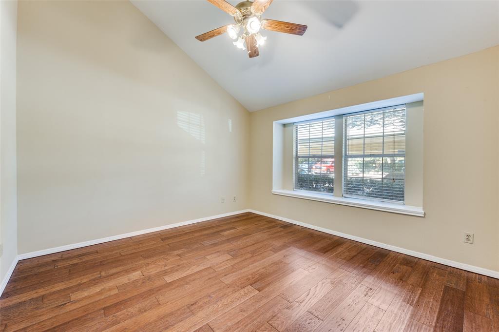 5565 Preston Oaks Road, Unit 130 Dallas, TX 75254 - Photo 13 of 25 Unfurnished room featuring wood-type flooring, a ceiling fan, and high vaulted ceiling