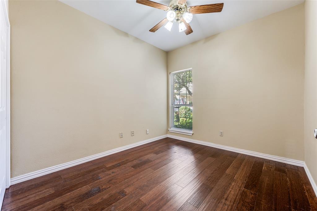 5565 Preston Oaks Road, Unit 130 Dallas, TX 75254 - Photo 18 of 25 Unfurnished room featuring dark wood-style flooring and a ceiling fan