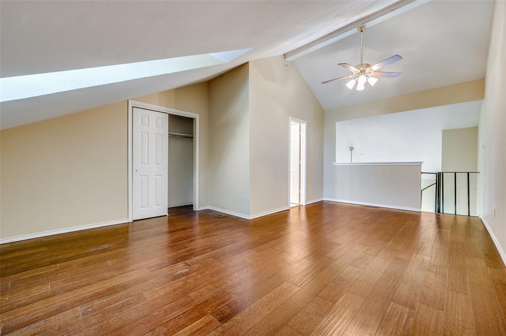 5565 Preston Oaks Road, Unit 130 Dallas, TX 75254 - Photo 20 of 25 Bonus room with a skylight, hardwood / wood-style floors, and a ceiling fan