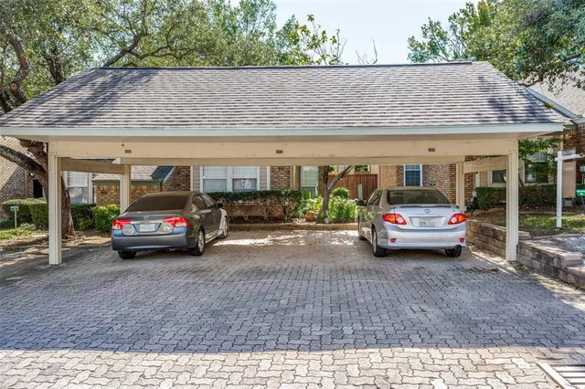 a view of cars parked in front of a building