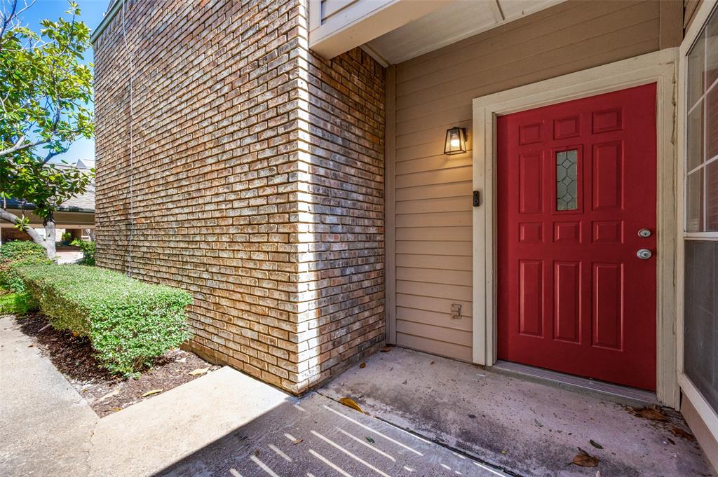 5565 Preston Oaks Road, Unit 130 Dallas, TX 75254 - Photo 4 of 25 Doorway to property with brick siding