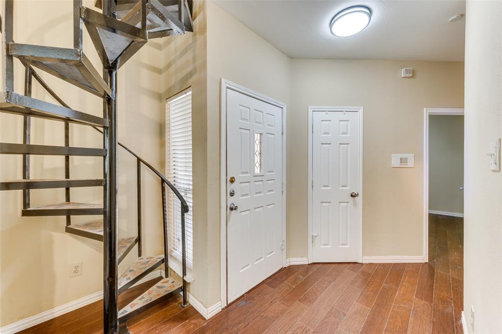 5565 Preston Oaks Road, Unit 130 Dallas, TX 75254 - Photo 7 of 25 Foyer entrance with wood finished floors and stairway