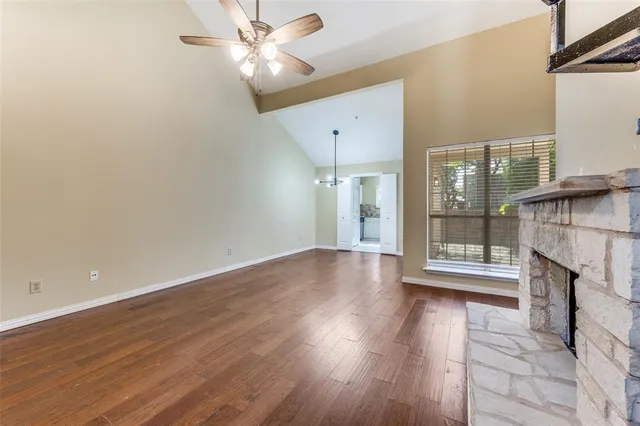 a view of livingroom with hardwood floor and a ceiling fan