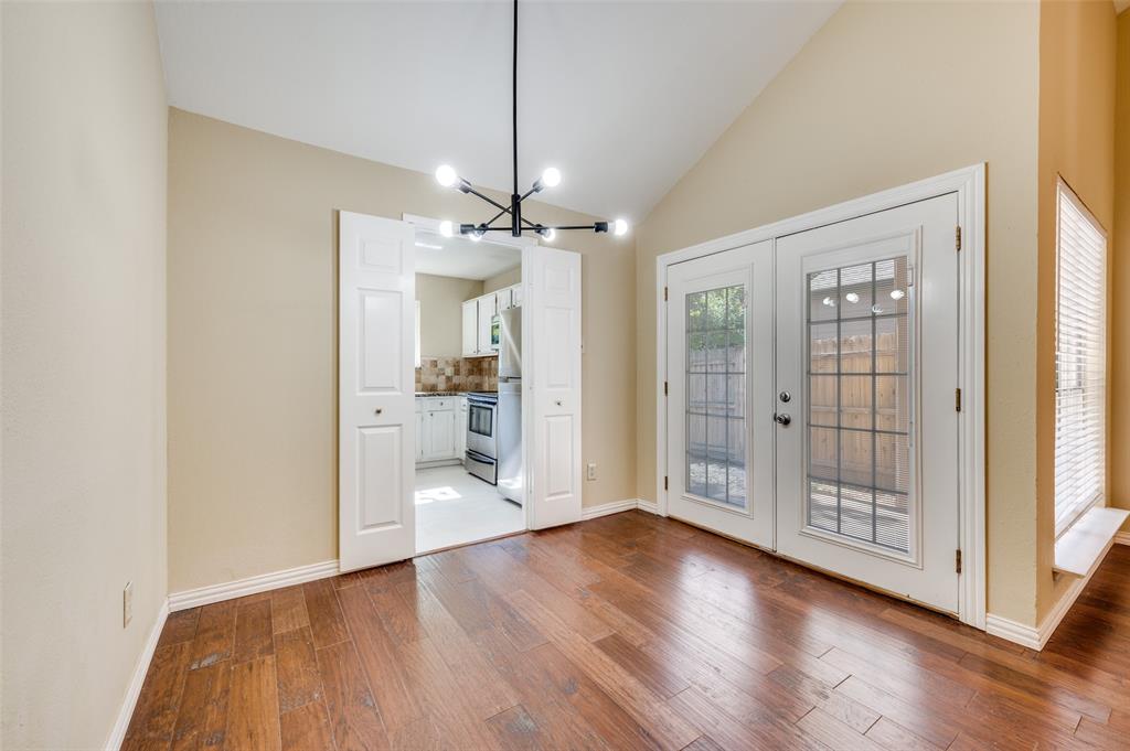 5565 Preston Oaks Road, Unit 130 Dallas, TX 75254 - Photo 10 of 25 Unfurnished dining area with light wood-type flooring, a chandelier, french doors, and high vaulted ceiling