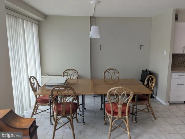 a view of a dining room with furniture and table