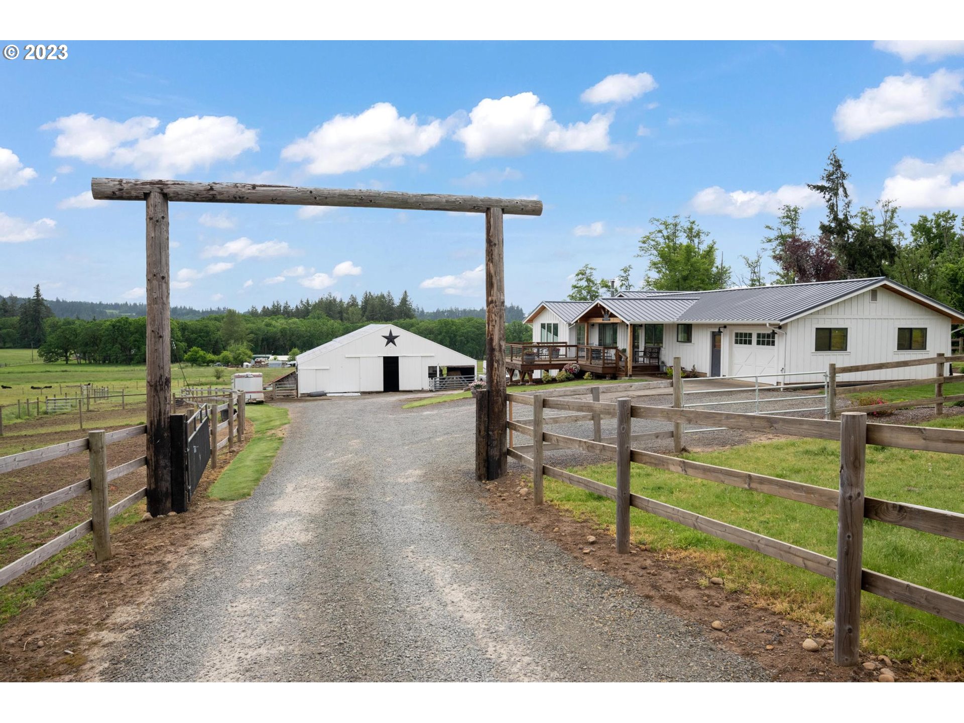a view of a house with backyard and porch