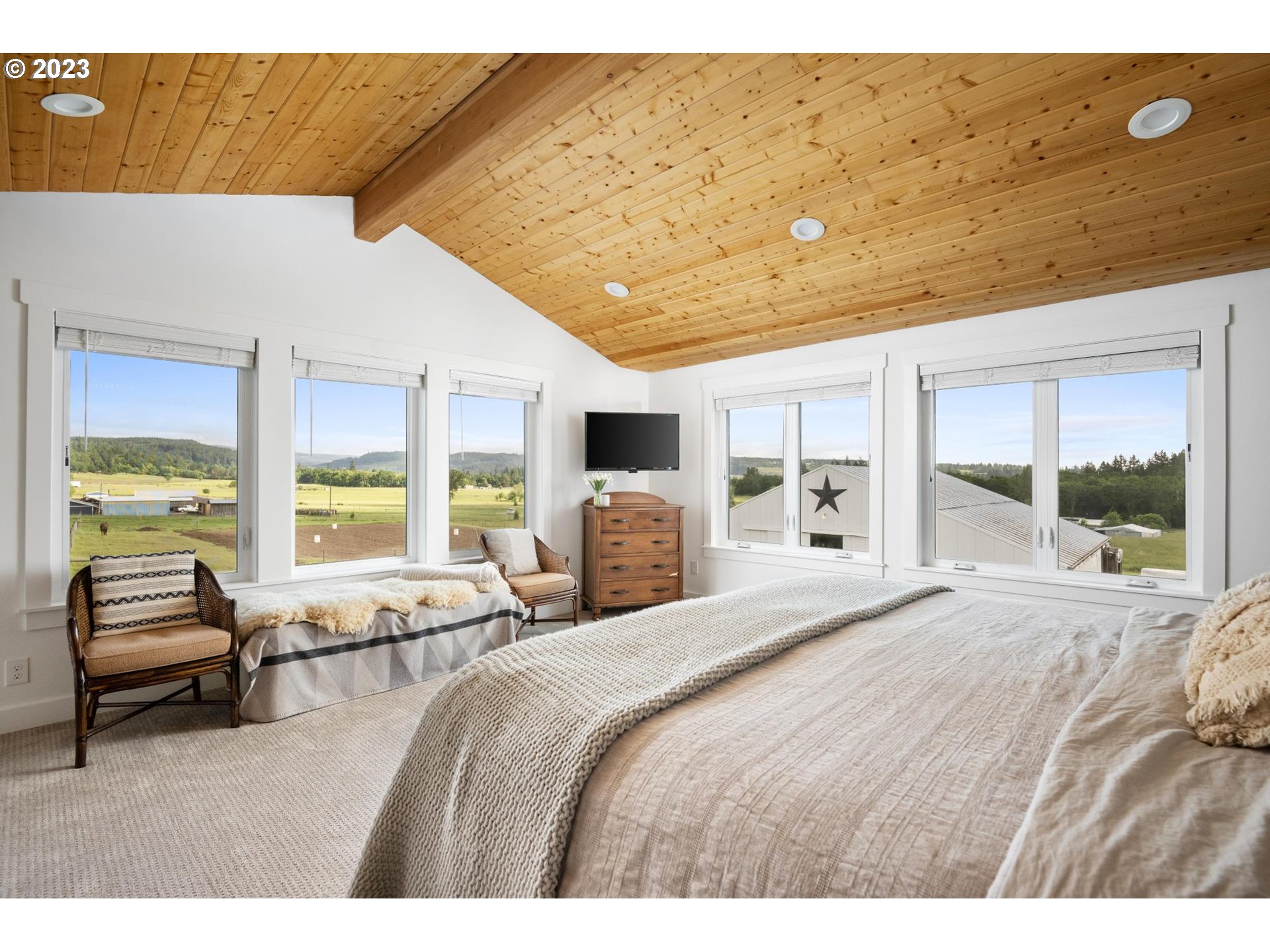 32877 South Wright Road Molalla, OR 97038 - Photo 13 of 34 a bedroom with a bed and large windows