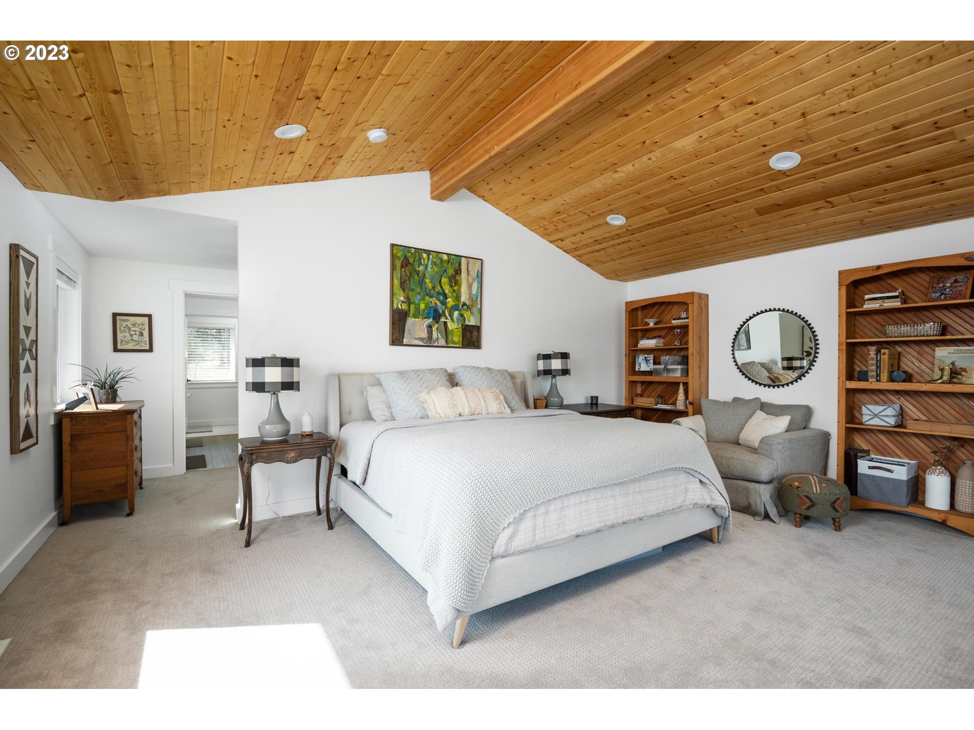 32877 South Wright Road Molalla, OR 97038 - Photo 15 of 34 a spacious bedroom with a bed a table and a potted plant
