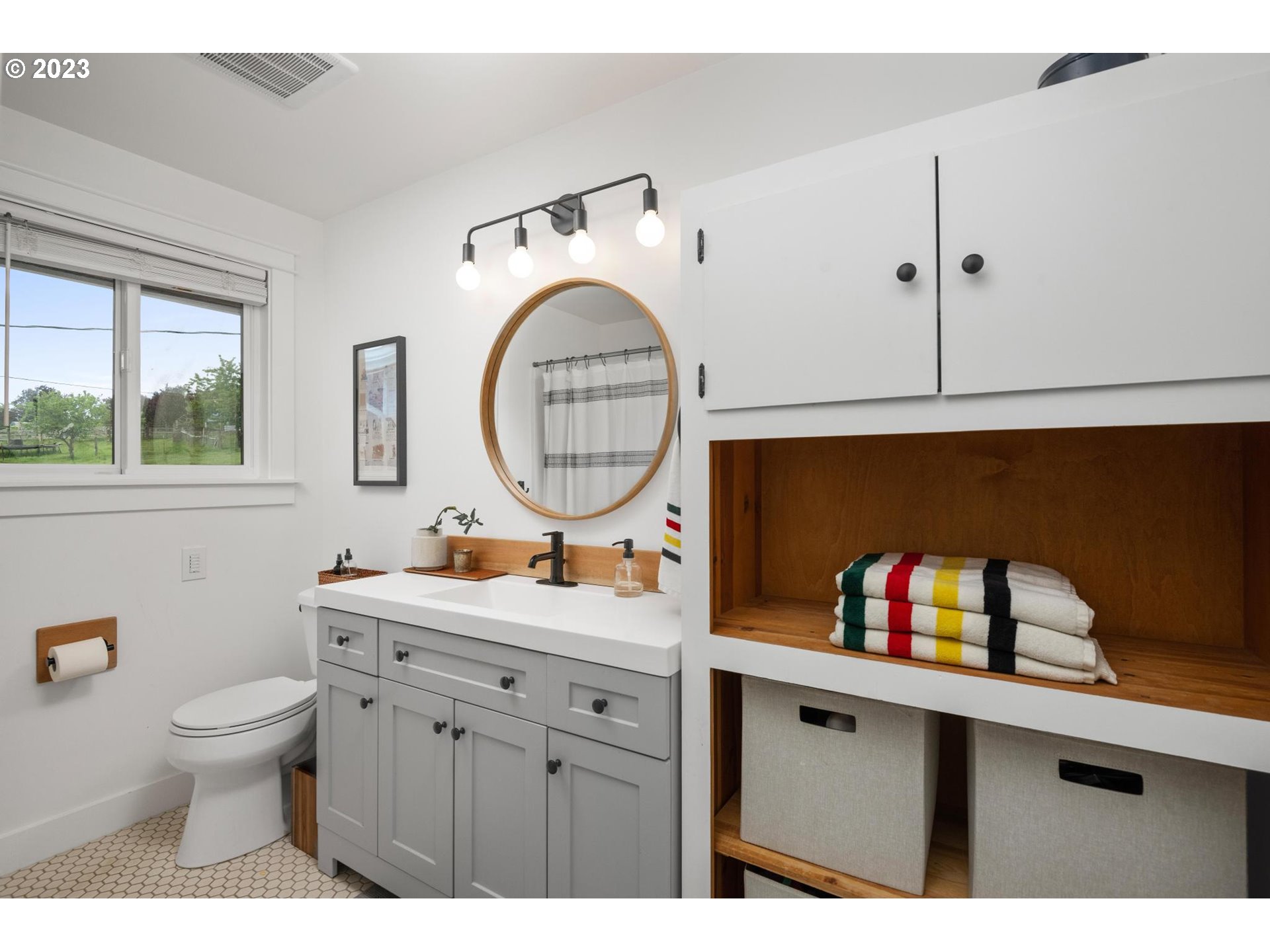 32877 South Wright Road Molalla, OR 97038 - Photo 22 of 34 a bathroom with a toilet sink and mirror