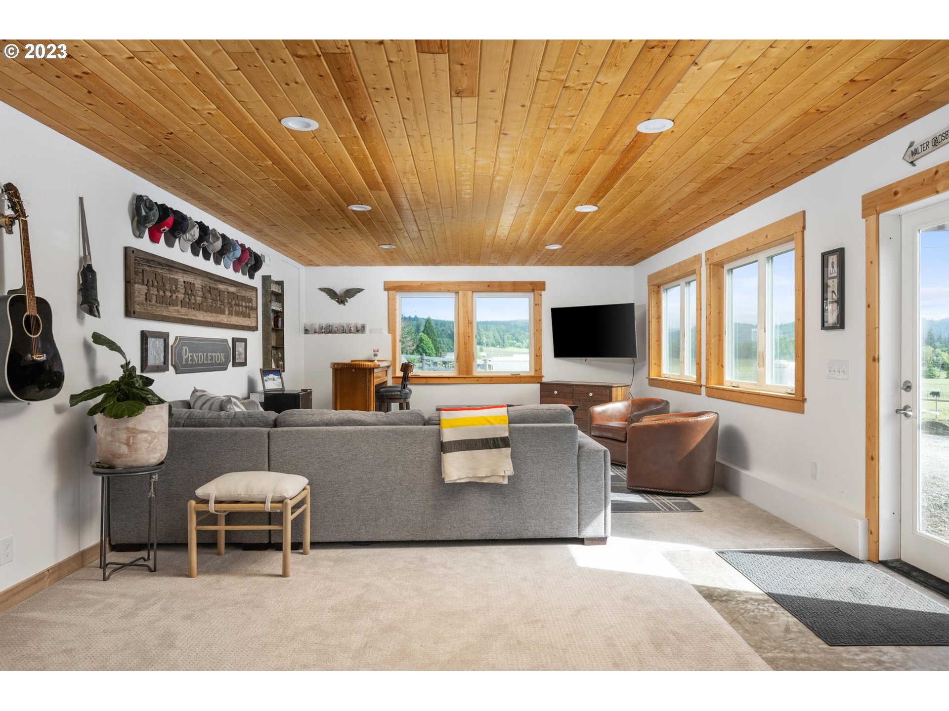 32877 South Wright Road Molalla, OR 97038 - Photo 25 of 34 a living room with furniture a flat screen tv and a large window