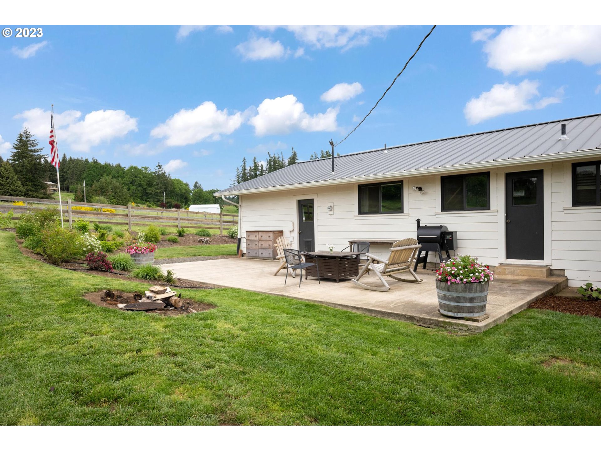 32877 South Wright Road Molalla, OR 97038 - Photo 27 of 34 a view of a house with backyard and sitting area