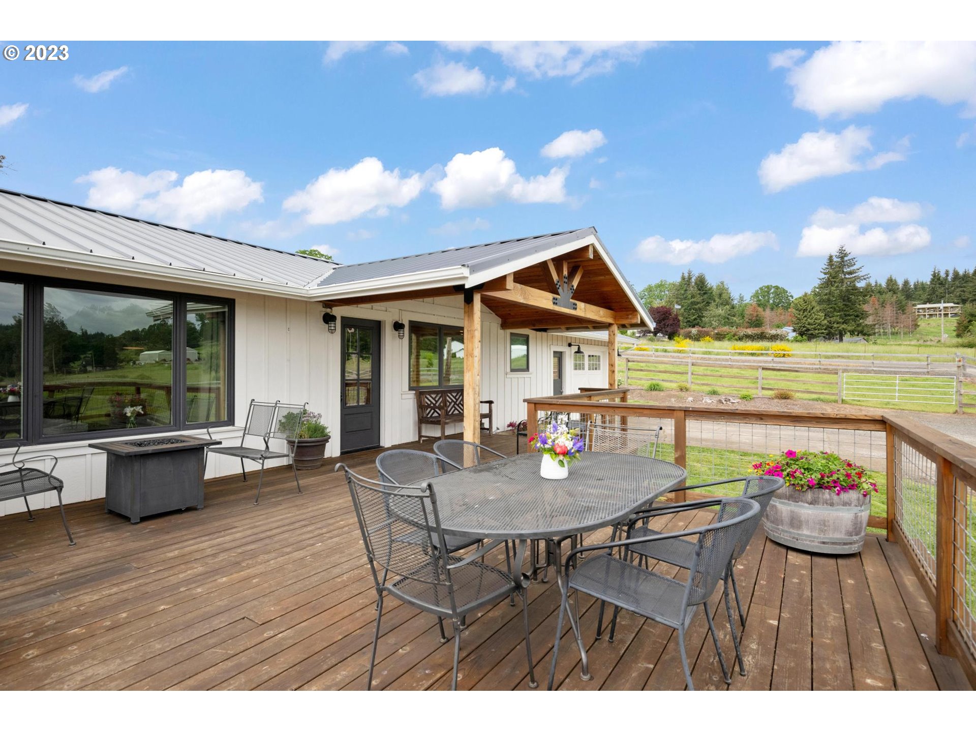 32877 South Wright Road Molalla, OR 97038 - Photo 4 of 34 a view of a dining table and chairs in the patio