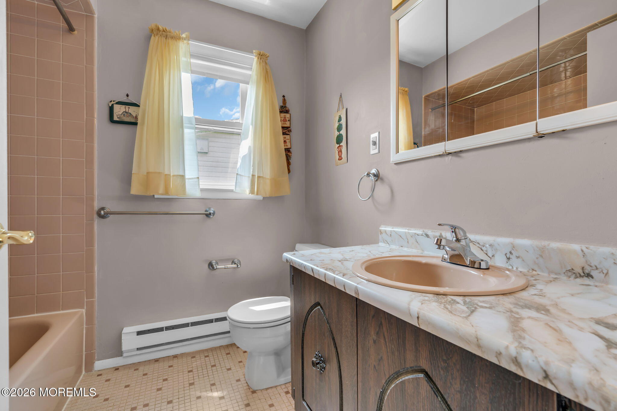 67 Blake Circle Brick, NJ 08724 - Photo 29 of 34 a bathroom with a sink a toilet and a mirror
