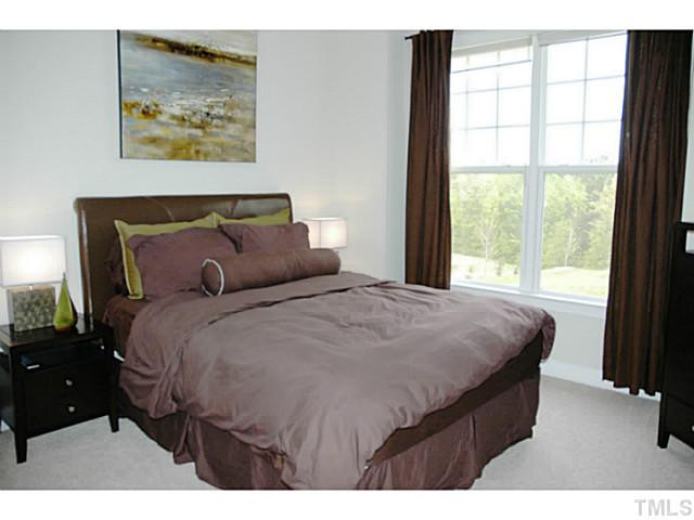 702 Ivyshaw Road Cary, NC 27519 - Photo 10 of 25 First floor bedroom and attached bath. Great for guests. Bedroom