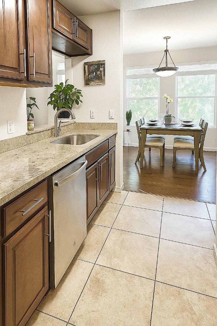 673 Royston Lane, Unit 233 Hayward, CA 94544 - Photo 3 of 32 a kitchen with a sink a counter top space cabinets and a potted plant