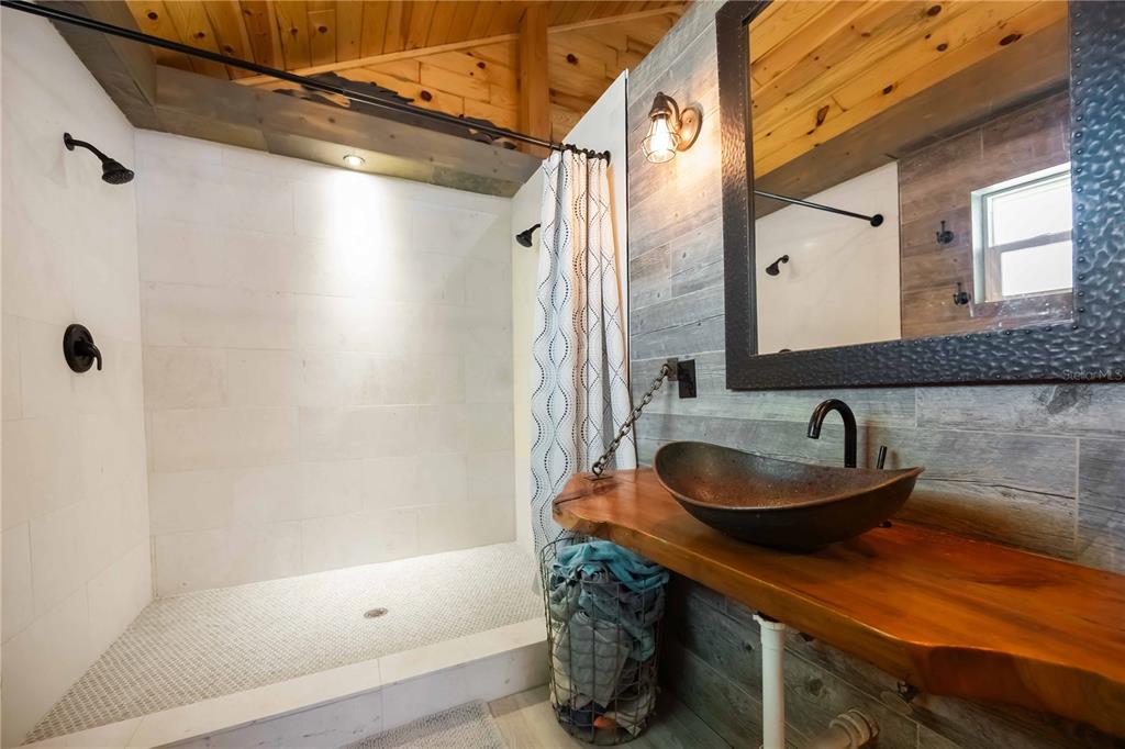 7348 Coach Road Port Charlotte, FL 33981 - Photo 21 of 48 a bathroom with a sink and a mirror